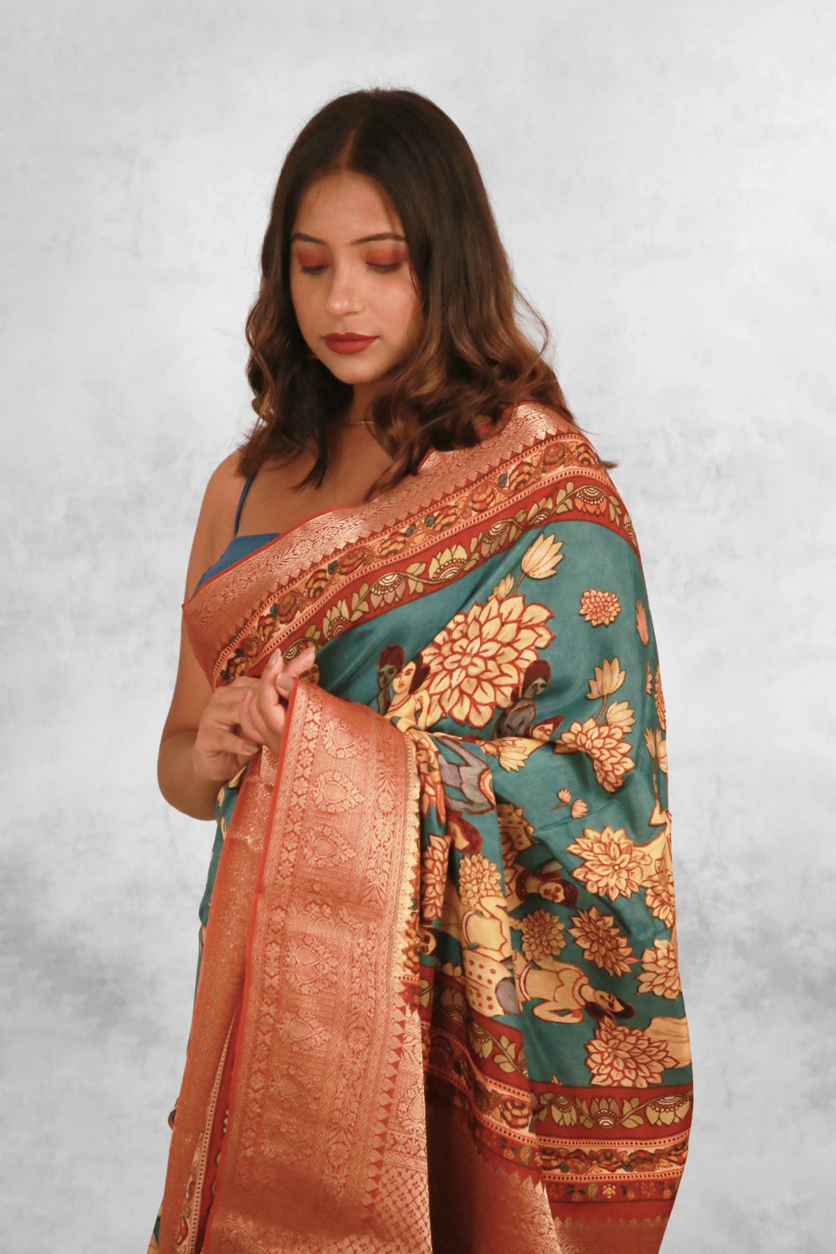 Figurative charms Classic Peacock Green Chanderi Saree with Lightweight Zari Draping