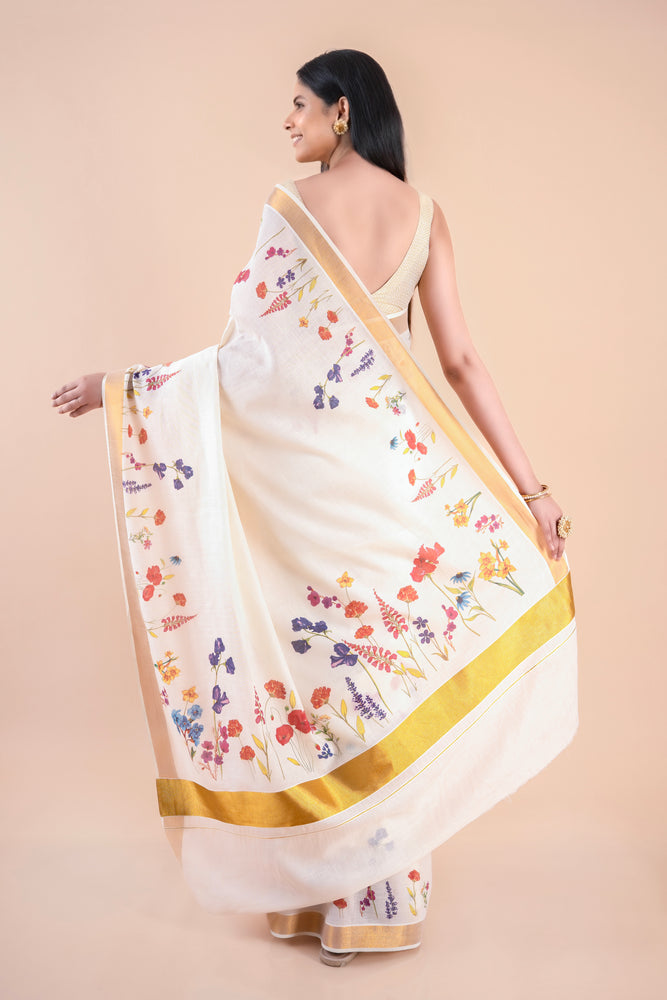 Nandana | Classic Kerala Cotton Kasavu Saree with Floral Design & Golden Zari Border