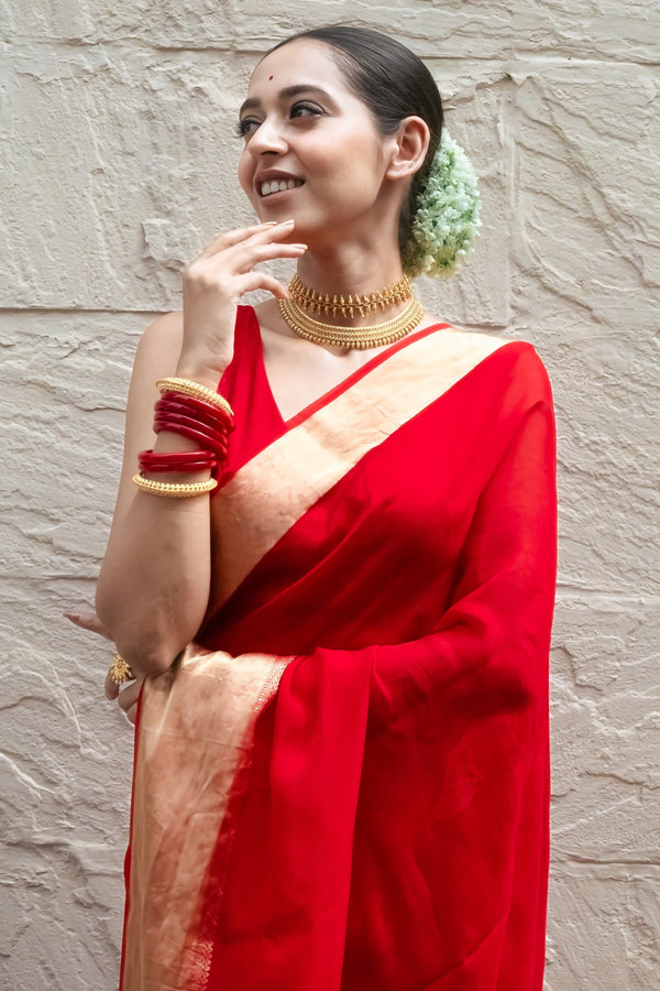 Sindoori elegance Women’s Red Khaddi Woven Saree with Ethnic Golden Border